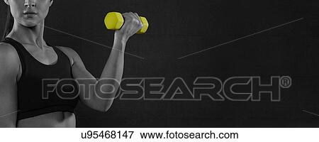 Young woman holding yellow hand weight. View Large Photo Image Stock Photo - Young woman holding yellow hand weight.. Fotosearch