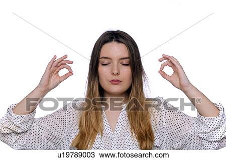 Stock Image - Young woman meditating.. Fotosearch