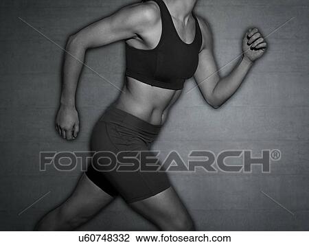 Stock Image - Young woman running, cropped shot.. Fotosearch