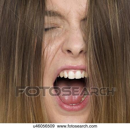 Young woman shouting with mouth open. View Large Photo Image Stock Photo - Young woman shouting with mouth open.. Fotosearch