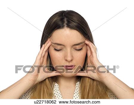 Stock Image - Young woman with hands touching face.. Fotosearch