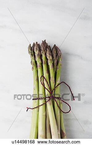 Asparagus tied with string View Large Photo Image Stock Photo - Asparagus tied with string. Fotosearch