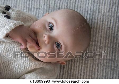 Baby girl looking at camera (18-23 months) View Large Photo Image Stock Image - Baby girl looking at camera (18-23 months). Fotosearch