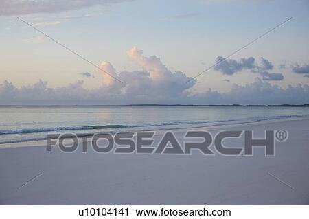 Stock Image - Beach with clouds. Fotosearch