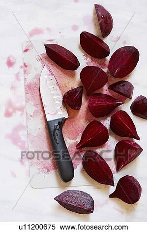 Beetroot on chopping board with kitchen knife View Large Photo Image Stock Photography - Beetroot on chopping board with kitchen knife. Fotosearch