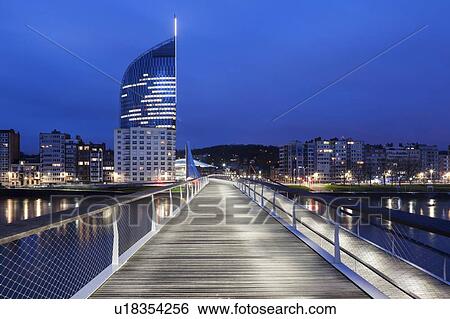 Stock Photograph - Belgium, Wallonia, Liege, Footbridge and cityscape. Fotosearch