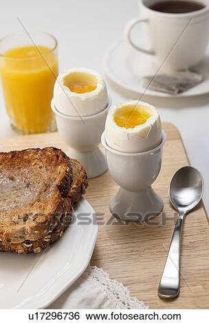 Stock Photograph - Boiled eggs and toast. Fotosearch