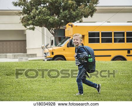 Boy with backpack at school View Large Photo Image Stock Photo - Boy with backpack at school. Fotosearch