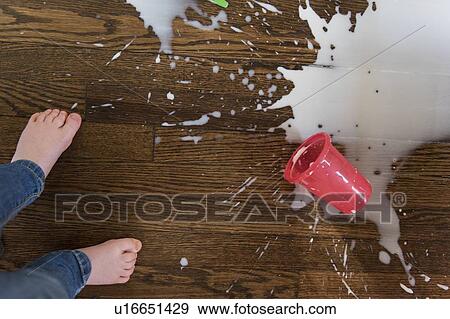 Boy's feet by spilt milkshake View Large Photo Image Stock Photo - Boy's feet by spilt milkshake. Fotosearch