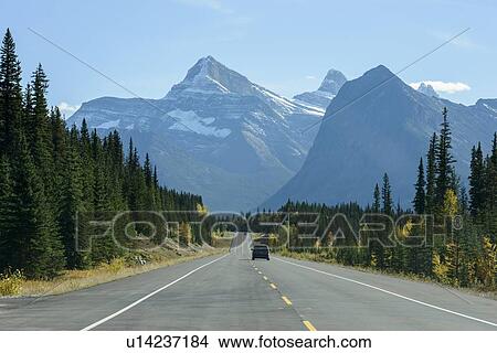 Picture - Canada, Alberta, Banff, AB-93 road in mountain landscape. Fotosearch