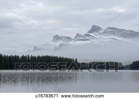 Stock Image - Canada, Alberta, Banff, Mountain peak over Two Jack Lake. Fotosearch