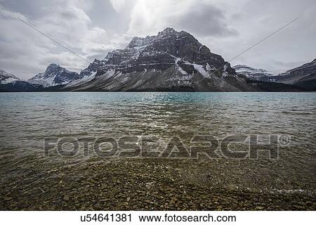 Canada, Alberta, Banff, Mountains reflecting in Bow Lake View Large Photo Image Stock Image - Canada, Alberta, Banff, Mountains reflecting in Bow Lake. Fotosearch