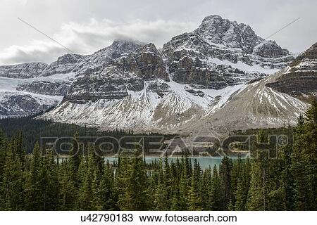 Canada, Alberta, Banff, Snowcapped mountains and Bow Lake View Large Photo Image Stock Image - Canada, Alberta, Banff, Snowcapped mountains and Bow Lake. Fotosearch