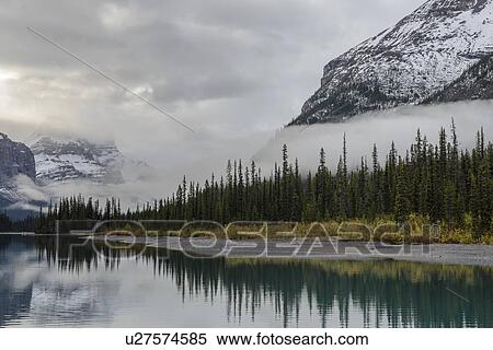 Canada, Alberta, Jasper, Mountains reflecting in Maligne Lake View Large Photo Image Stock Photography - Canada, Alberta, Jasper, Mountains reflecting in Maligne Lake. Fotosearch