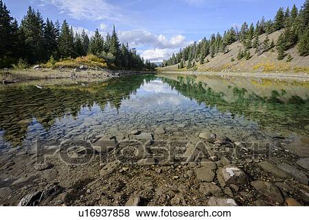 Stock Photo - Canada, Alberta, Jasper, View of lake in Valley of Five Lakes. Fotosearch