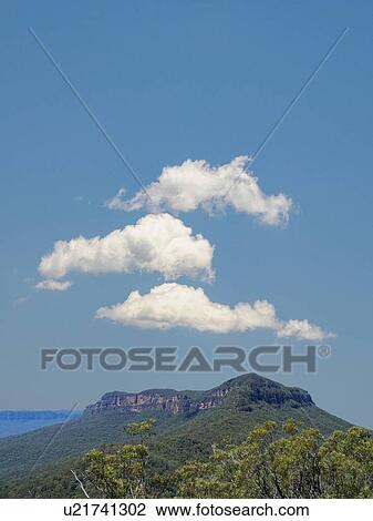 Stock Image - Clouds above Blue Mountains National Park. Fotosearch
