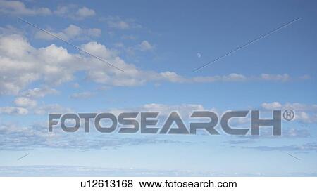 Clouds in blue sky View Large Photo Image Stock Photo - Clouds in blue sky. Fotosearch