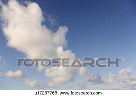 Clouds in blue sky View Large Photo Image Stock Photo - Clouds in blue sky. Fotosearch