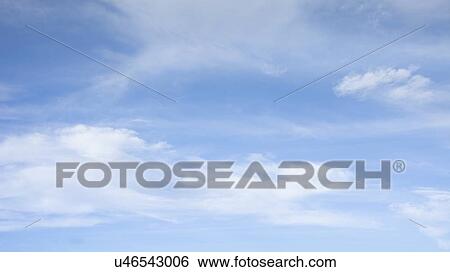 Stock Photograph - Clouds in blue sky. Fotosearch