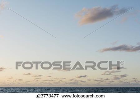 Clouds in sky at dawn View Large Photo Image Stock Photo - Clouds in sky at dawn. Fotosearch