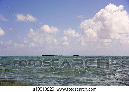 Stock Photo - Clouds over sea. Fotosearch