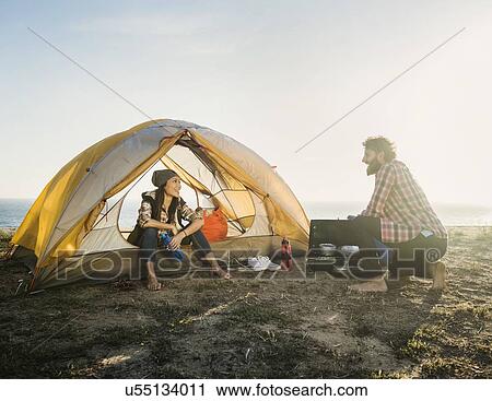 Couple camping on beach View Large Photo Image Stock Image - Couple camping on beach. Fotosearch