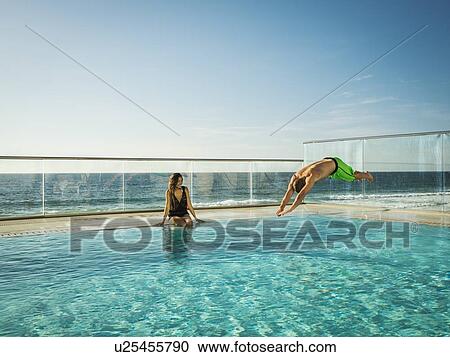 Couple in swimming pool View Large Photo Image Stock Image - Couple in swimming pool. Fotosearch