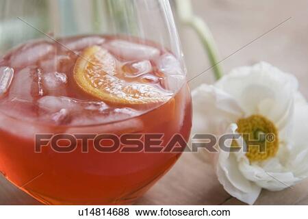 Drink and flower on wooden table View Large Photo Image Stock Photo - Drink and flower on wooden table. Fotosearch