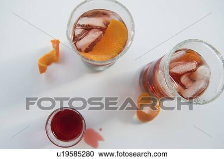 Stock Image - Drinks in glasses on white background. Fotosearch