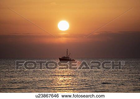 Fishing boat at sunset View Large Photo Image Stock Photograph - Fishing boat at sunset. Fotosearch