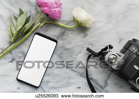 Stock Image - Flowers, smart phone and digital camera. Fotosearch