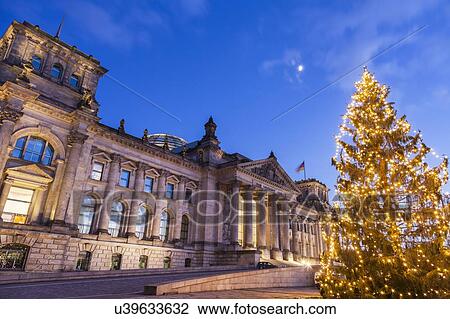Stock Image - Germany, Berlin, Christmas tree in front of Reichstag. Fotosearch