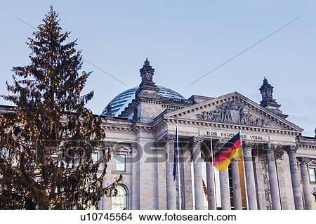 Picture - Germany, Berlin, German flag in front of Reichstag. Fotosearch