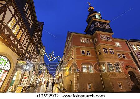 Stock Image - Germany, Thuringia, Eisenach, Architecture and christmas ornaments down street. Fotosearch