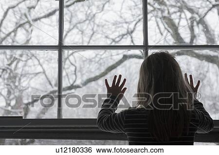 Stock Photograph - Girl by window. Fotosearch