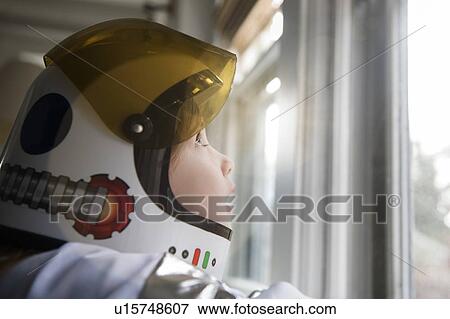 Stock Photo - Girl wearing helmet. Fotosearch
