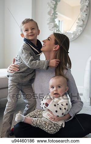 Happy mother spending time with children (18-23 months, 4-5) View Large Photo Image Stock Photograph - Happy mother spending time with children (18-23 months, 4-5). Fotosearch