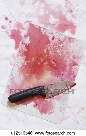 Kitchen knife on chopping board with red juice View Large Photo Image Stock Photograph - Kitchen knife on chopping board with red juice. Fotosearch