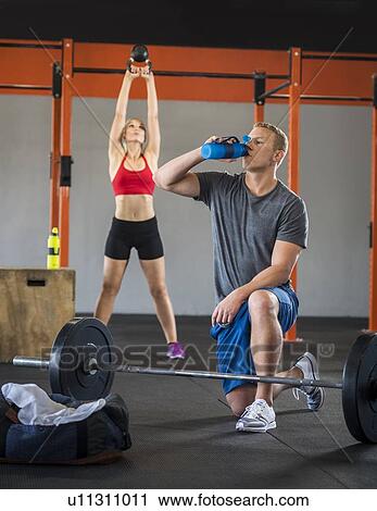 Man and woman working out View Large Photo Image Stock Image - Man and woman working out. Fotosearch