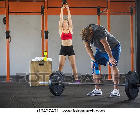 Man and woman working out View Large Photo Image Stock Image - Man and woman working out. Fotosearch