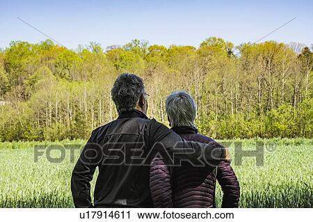 Mature couple in field View Large Photo Image Stock Image - Mature couple in field. Fotosearch