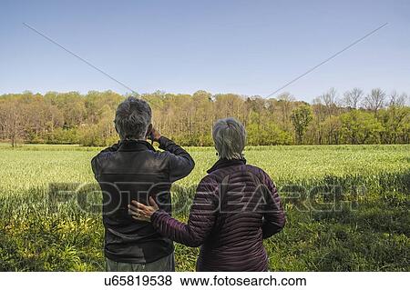 Stock Photo - Mature couple in field. Fotosearch