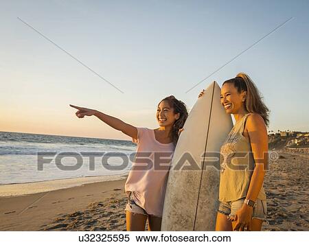 Mother and daughter with surfboard View Large Photo Image Stock Photography - Mother and daughter with surfboard. Fotosearch
