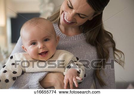 Picture - Mother holding baby (18-23 months). Fotosearch