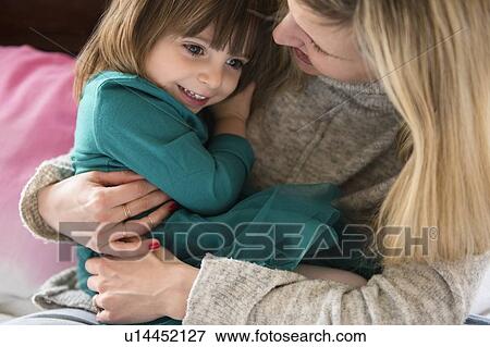 Mother holding daughter (2-3) View Large Photo Image Stock Photo - Mother holding daughter (2-3). Fotosearch
