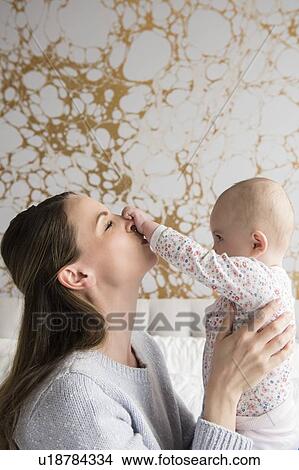 Picture - Mother playing with baby (18-23 months). Fotosearch