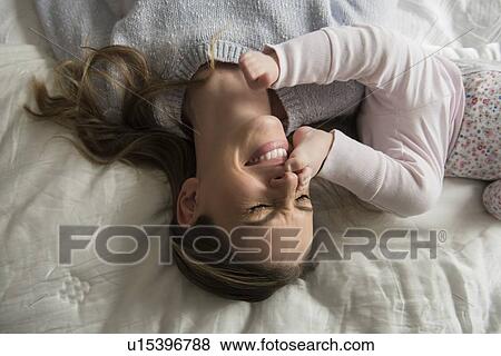 Mother playing with baby (18-23 months) View Large Photo Image Stock Photo - Mother playing with baby (18-23 months). Fotosearch