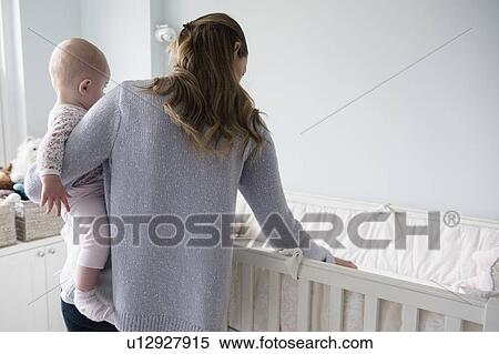 Mother with baby (18-23 months) in arms View Large Photo Image Stock Photography - Mother with baby (18-23 months) in arms. Fotosearch