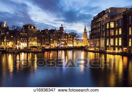 Netherlands, Amsterdam, Building upon canal at dusk View Large Photo Image Stock Photo - Netherlands, Amsterdam, Building upon canal at dusk. Fotosearch