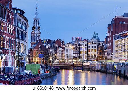 Stock Photo - Netherlands, Amsterdam, Canal at dusk. Fotosearch